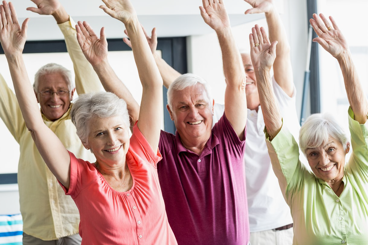 seniors raising their arms