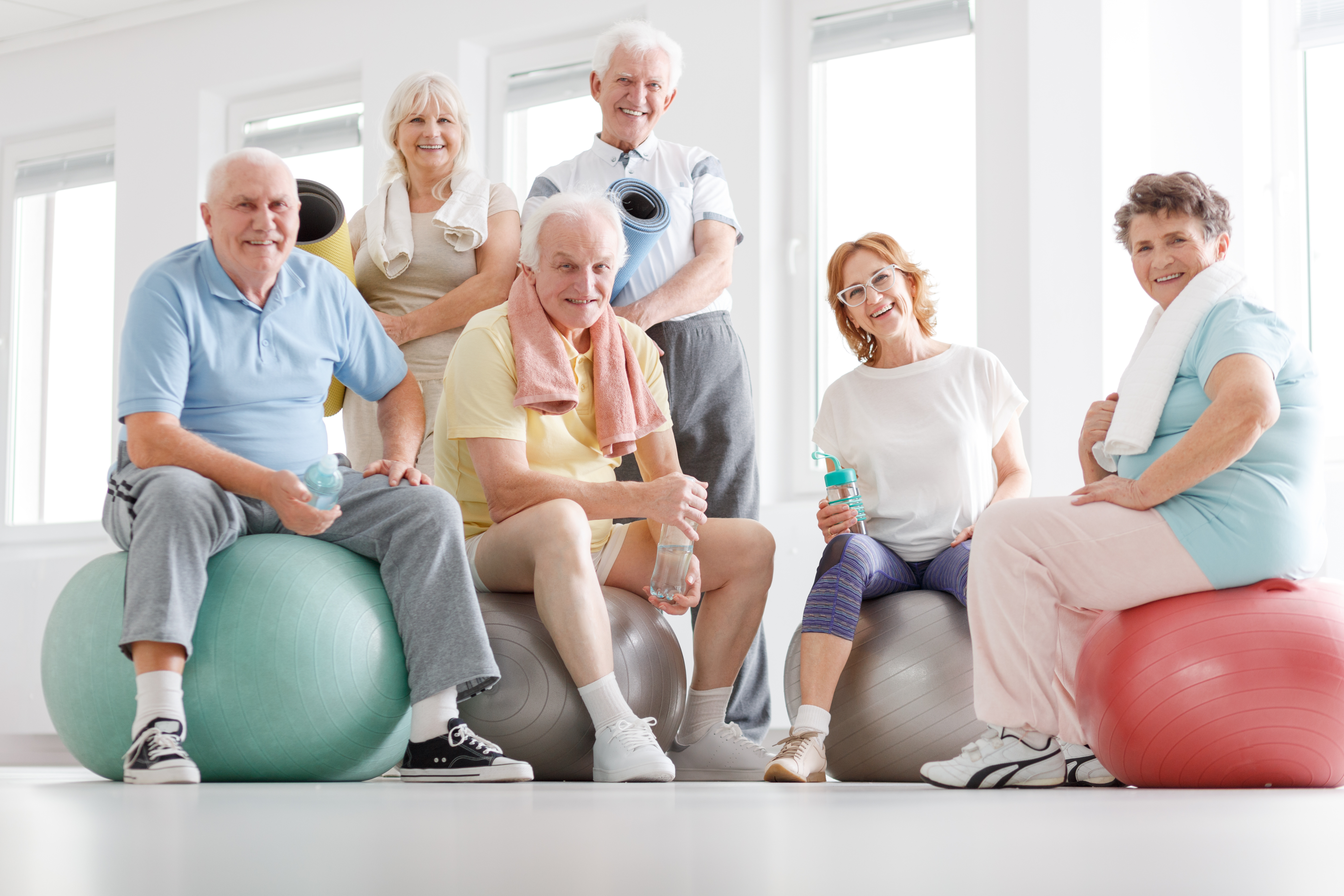 Seniors sitting on yoga balls