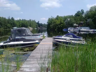 Boat dock with two boats on each side.  