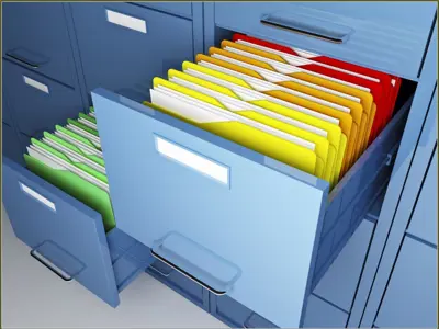 two filing cabinets each with one drawer open with exposed files