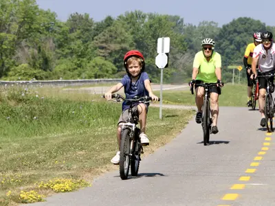 Bike riders on the Parkway Trail