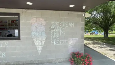 Building with chalk art on the right which looks like an icecream cone