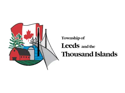 Leeds and the Thousand Islands logo with barn, silo, Canada flag, bridge and two trees.