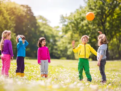 children playing with a ball in the park