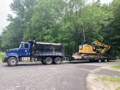 Township Truck with float trailer carrying bulldozer