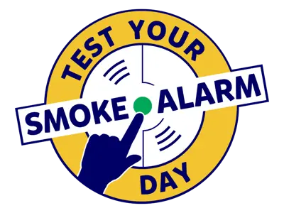 image of a smoke alarm and finger pushing the botton with the text Test your smoke alarm day