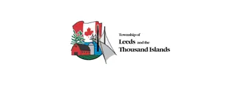 Township logo consisting of a Canadian flag, red barn, silo, bridge and body of water with the text, Township of Leeds and the Thousand Islands