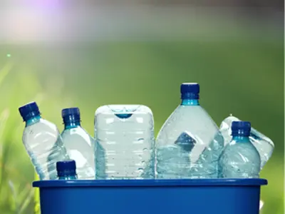 recycle bin filled with plastic bottle