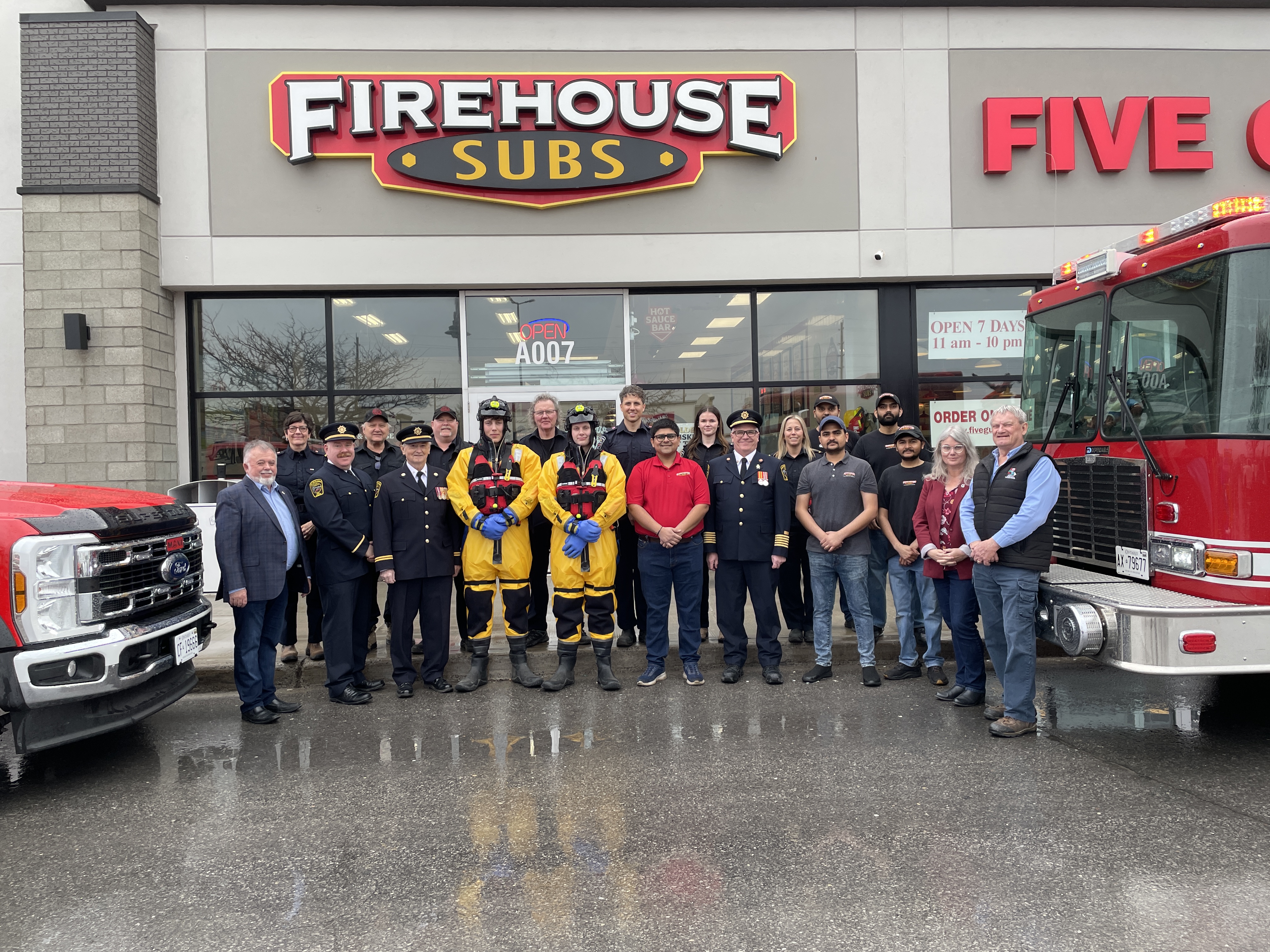 Group of people in front of Firehouse Subs